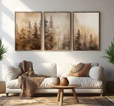 a living room with three paintings on the wall