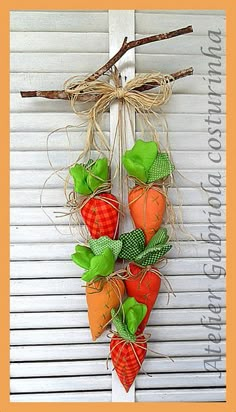 some carrots are hanging on the side of a building with burlocks around them