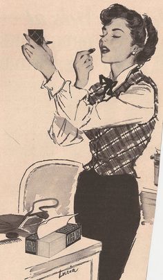 a woman in an apron is holding something up to her face and looking at it