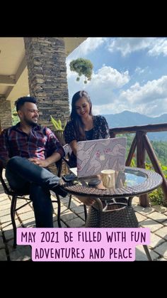 two people sitting at a table with a map on it