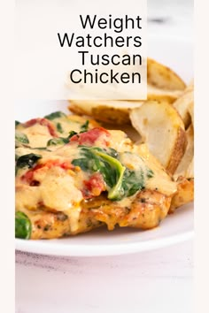 a white plate topped with chicken covered in cheese and spinach