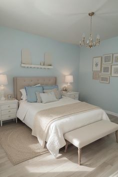 a bedroom with blue walls and white furniture