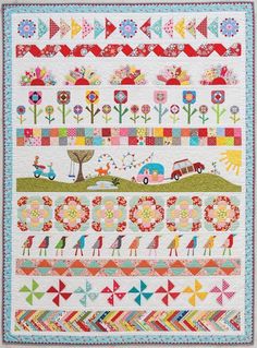 a quilted wall hanging with colorful flowers and birds in the center, on top of a white background