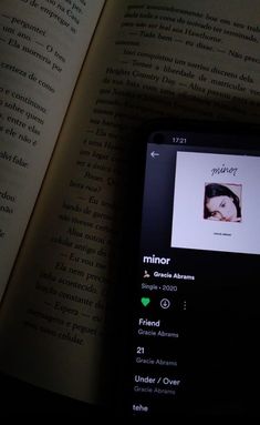 an open book with the image of a woman's face and name on it