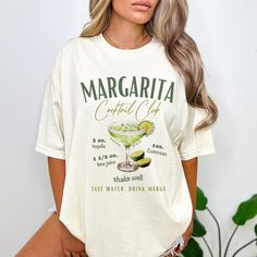 ❤ Get ready to celebrate with our playful Margarita Cocktail Club design. Our Luxury T-shirts are pure comfort! Each piece is thoughtfully designed as UNISEX, ensuring a perfect fit in true UNISEX sizes. And of course, you can elevate your style with an effortlessly oversized look by ordering 1 or 2 sizes up. ❤Buy any 2 or more & get 30% off coupon! Use: 30OFF ❤Our commitment to quality is reflected in our use of a high-grade ink printing method, delivering graphics with a sharp and crisp appearance. The ink seamlessly integrates with the fibers, ensuring both vibrant visuals and remarkable durability for your apparel. ❤ Luxury Comfort Colors Brand ❤100% cotton - premium quality, medium fabric weight ❤ Very Soft and Extra Cozy ❤ Relaxed fit ❤ True to UNISEX Sizes, for oversized look go 1 o Margarita Shirts Funny, Luxury Brand T Shirt Design, Drinking Night, Margarita Cocktail, Cocktail Club, Ink Printing, Margarita Recipe, Graphic Tshirt Design, Drinking Shirts