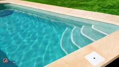 an empty swimming pool with grass in the background