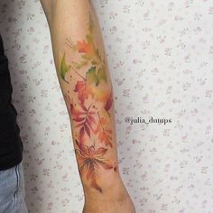 a person with a tattoo on their arm and the words popsugar above it