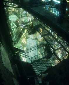 an aerial view of a futuristic city at night