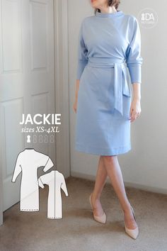 a woman standing in front of a door wearing a blue dress