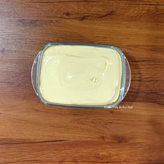 a wooden table with a bowl of food on it