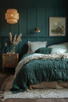 a bedroom with teal walls and wooden flooring is pictured in this image, the bed has a green comforter on it