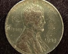 an old coin with a man's face on it