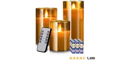 three gold candles with remote controls on each one and six bottles in the background for sale