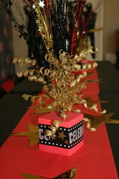 there is a table with red and black decorations on it, along with gold stars