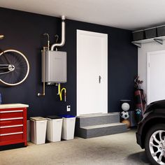 a car is parked in front of a garage with two bikes hanging on the wall