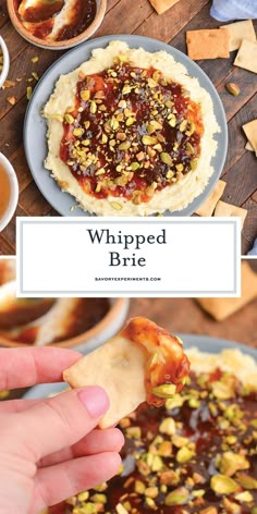 a hand holding a cracker over a plate of food with the words whipped brie on it