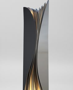 a tall metal sculpture with an intricate design on it