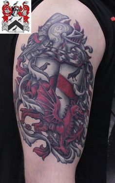 a man with a tattoo on his arm that has an image of a shield and dragon