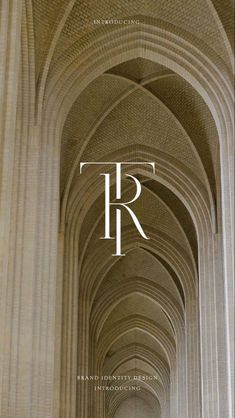 the front cover of an architectural magazine, featuring columns and arches with white letters on them