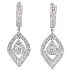 Lustrous 2.78ct Diamonds Dangling Earrings in 14k White Gold - IGI Certified Elevate your elegance with these glamorous 14k white gold dangling earrings, adorned with 266 dazzling round diamonds. With a total carat weight of 2.78-carat, these diamonds boast a pristine color grade, clarity, and a very good cut, ensuring maximum brilliance and sparkle. These diamond dangling earrings are the epitome of luxury and sophistication, perfect for any special occasion. Metal: 14k White Gold Main stone: 2 Diamond Dangling Earrings, Gold Dangling Earrings, Pave Diamond Ring, Diamond Dangle Earrings, Long Dangle Earrings, Cushion Cut Diamonds, Dangling Earrings, Modern Earrings, Diamond Stone