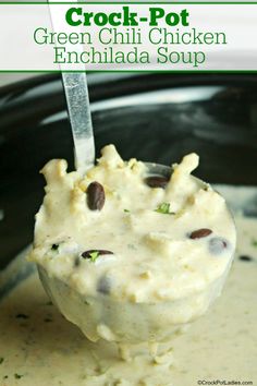 crock pot green chili chicken enchilada soup in a bowl with a spoon