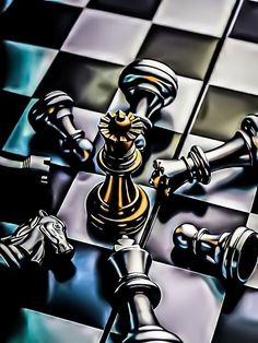 a chess board with some black and gold pieces on it