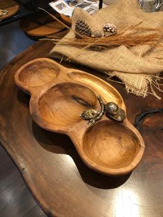 three wooden spoons sitting on top of a table