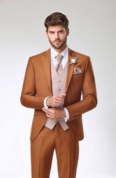 a man in a brown suit and tie