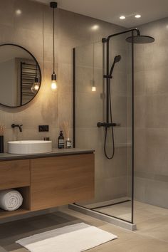 a bathroom with a shower, sink and mirror