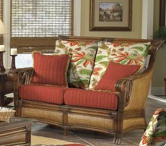 a living room scene with focus on the couch and chair, coffee table and lamp