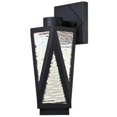 an outdoor wall light that is black and has a glass panel on the front side