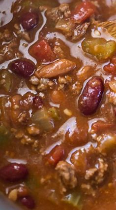 a white bowl filled with chili and beans