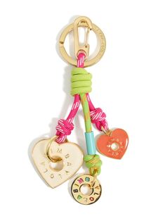 a keychain with two charms attached to it's end and a heart