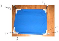 an image of a blue cloth on the floor with measurements for it to be cut in half