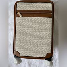 Please Look At Approximate Dimension Below Before Purchasing. This Is A Perfect Carry On Size! Measures Approximately: 13"W X 18.5"H X 8"D 100% Authentic Michael Kors Jet Set Travel Rolling Trolley Suitcase Luggage. Brand New!! Never Used. Features: Logo-Print Canvas 69% Coated Canvas/17% Polyester/13% Cotton/1% Polyurethane Measures Approximately: 13"W X 18.5"H X 8"D Handle Drop: 1" Exterior Details: 360-Degree Rotating Wheels Interior Details: 2 Back Zip Pockets, 2 Front Zip Pockets, Clip-Ins. Gym Handbag, Michael Kors Luggage, Vanilla Color, Three Logo, Travel Cubes, Carry On Size, Luggage Trolley, Exterior Details, Blue Purse