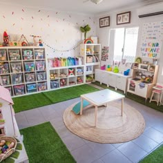 a child's playroom with toys and bookshelves