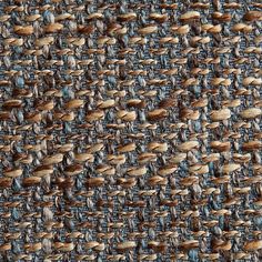 an up close shot of a blue and brown woven material