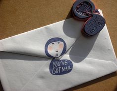 a close up of an envelope with a rubber stamp on it and a wax seal