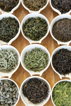 many bowls filled with different types of teas