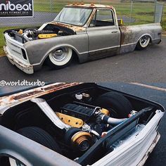 an old truck has been transformed into a new one with the hood up and engine in place