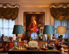 a room filled with lots of different types of furniture and lamps on top of a table