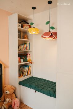 a child's room with bookshelves and stuffed animals