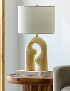 a table lamp sitting on top of a wooden table