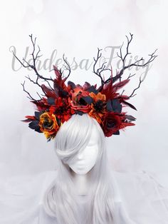 This Fire Goddess Headdress is a spectacular red and black fire branch headpiece. Great for a Fire fairy cosplay or a gothic demon or witch headdress. A fiery headpiece resplendent with sparkly glittery red 'flames' and red black feathers amongst the blackened branches.  The flowers are flame coloured and have small blackened plant sprigs in between, so it looks as if the fire is burning them. The flowers are blackened and ashy looking for added burnt effect. There are red Swarovskis dotted alon Fire Witch Costume, Fire Crown Aesthetic, Fire Goddess Costume, Fire Fairy Outfit, Fire Fairy Costume, Fire Headdress, Fire Themed Outfits, Fire Headpiece, Fire Gown