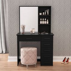 a dressing table with a mirror, stool and shoes on the floor next to it