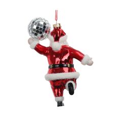 a red and white christmas ornament with a disco ball hanging from it's side