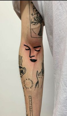 a man's arm with tattoos on it and an image of a woman's face