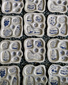 blue and white plates with designs on them