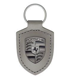 a leather key chain with a porsche emblem on the front and back side of it