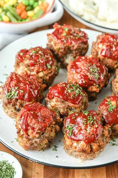 meatballs covered in ketchup on a plate